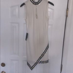 Bebe beaded asymmetrical dress NWT. Stunner!!!